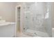 Modern bathroom with large walk-in shower and marble tile at 1847 Ridgeland Dr, Decatur, GA 30032