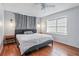 Main bedroom with hardwood floors and a king-size bed at 873 Hearthstone Dr, Stone Mountain, GA 30083