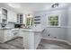 Updated kitchen with white cabinets, granite counters, and wood floors at 873 Hearthstone Dr, Stone Mountain, GA 30083