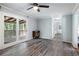 Living room with hardwood floors and access to a deck at 873 Hearthstone Dr, Stone Mountain, GA 30083