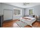 Spacious bedroom with hardwood floors and ample natural light at 873 Hearthstone Dr, Stone Mountain, GA 30083