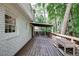 Spacious deck with wood railing, offering a peaceful wooded view at 873 Hearthstone Dr, Stone Mountain, GA 30083