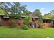 Brick house with a large backyard and mature trees at 1272 Breezy Ne Ln, Atlanta, GA 30329