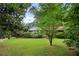 Brick ranch house with a front porch and large yard at 1272 Breezy Ne Ln, Atlanta, GA 30329