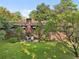Brick house with a large backyard and mature trees at 1272 Breezy Ne Ln, Atlanta, GA 30329