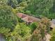 Aerial view of a house nestled among lush trees at 1272 Breezy Ne Ln, Atlanta, GA 30329