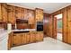 Kitchen with wood cabinets, appliances, and tile floor at 1272 Breezy Ne Ln, Atlanta, GA 30329