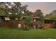 Back of brick house, showcasing a large yard at 1272 Breezy Ne Ln, Atlanta, GA 30329