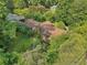 Aerial view of a brick house on a large lot at 1272 Breezy Ne Ln, Atlanta, GA 30329