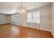 Hardwood floor living room with chandelier and view to kitchen at 1272 Breezy Ne Ln, Atlanta, GA 30329