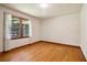 Simple bedroom with hardwood floors and a window at 1272 Breezy Ne Ln, Atlanta, GA 30329
