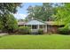 Brick ranch house with a front porch and large yard at 1272 Breezy Ne Ln, Atlanta, GA 30329