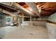 Unfinished basement with window and stairs at 1272 Breezy Ne Ln, Atlanta, GA 30329