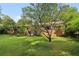 Brick house with a large backyard and mature trees at 1272 Breezy Ne Ln, Atlanta, GA 30329