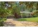 Brick ranch house with a front porch and large yard at 1272 Breezy Ne Ln, Atlanta, GA 30329