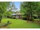 Brick ranch house with a front porch and large yard at 1272 Breezy Ne Ln, Atlanta, GA 30329
