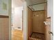 Bathroom with shower, gray tile, and a checkered floor at 1272 Breezy Ne Ln, Atlanta, GA 30329