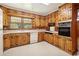 Kitchen with wood cabinets, appliances, and tile floor at 1272 Breezy Ne Ln, Atlanta, GA 30329