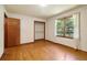 Bedroom with hardwood floors, window, and closet at 1272 Breezy Ne Ln, Atlanta, GA 30329