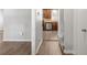 View of kitchen and stairs from hallway at 2915 Landmark Se Dr, Conyers, GA 30094