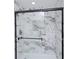 Clean shower with marble tile and glass enclosure at 794 Casplan Sw St, Atlanta, GA 30310