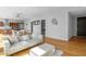 Open living area with hardwood floors and access to a balcony at 45 Ivan Allen Jr. Nw Blvd # 2501, Atlanta, GA 30308