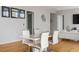 Modern dining area with white table and chairs at 45 Ivan Allen Jr. Nw Blvd # 2501, Atlanta, GA 30308