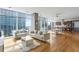 Modern living room with hardwood floors and city views at 45 Ivan Allen Jr. Nw Blvd # 2501, Atlanta, GA 30308
