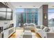 Living room with hardwood floors, city views, and comfortable sofas at 45 Ivan Allen Jr. Nw Blvd # 2501, Atlanta, GA 30308