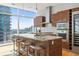 Modern kitchen with island, wine storage, and stainless steel appliances at 45 Ivan Allen Jr. Nw Blvd # 2501, Atlanta, GA 30308