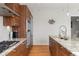 Modern kitchen with wood cabinets and granite countertops at 45 Ivan Allen Jr. Nw Blvd # 2501, Atlanta, GA 30308