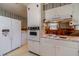 Kitchen with retro appliances and wood paneling at 1645 Highpoint Rd, Snellville, GA 30078