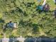Aerial view of house and surrounding woodland at 1645 Highpoint Rd, Snellville, GA 30078