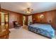 Main bedroom with ceiling fan, ensuite access and rocking chair at 1645 Highpoint Rd, Snellville, GA 30078