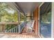Relaxing front porch with rocking chairs and brick flooring at 1645 Highpoint Rd, Snellville, GA 30078