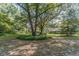 Expansive backyard with lush trees and grass at 1645 Highpoint Rd, Snellville, GA 30078