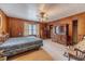 Main bedroom with ceiling fan, dresser and rocking chair at 1645 Highpoint Rd, Snellville, GA 30078