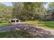 Gravel driveway leading to a detached garage at 1645 Highpoint Rd, Snellville, GA 30078
