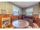 Cozy wood-paneled dining area with built-in desk and vintage wallpaper at 1645 Highpoint Rd, Snellville, GA 30078