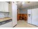 Kitchen area with refrigerator, washer, and dryer at 1645 Highpoint Rd, Snellville, GA 30078