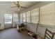 Sunroom with multiple windows and ceiling fan at 1645 Highpoint Rd, Snellville, GA 30078