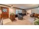 Spacious living room with brick wall, carpeting, and built-ins at 1645 Highpoint Rd, Snellville, GA 30078