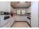 Retro kitchen with white cabinets and built-in appliances at 1645 Highpoint Rd, Snellville, GA 30078