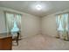 Bedroom with carpeted floor and two windows at 1645 Highpoint Rd, Snellville, GA 30078