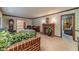 Living room with brick fireplace, built-in shelving, and carpeting at 1645 Highpoint Rd, Snellville, GA 30078