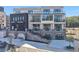Modern building with retail space on the ground floor and residential units above at 8200 Main St # 1206, Woodstock, GA 30188