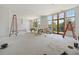 Spacious living room with large windows and unfinished hardwood floors at 8200 Main S St # 1306, Woodstock, GA 30188