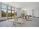Living room with large windows offering a view and unfinished flooring at 8200 Main S St # 1306, Woodstock, GA 30188