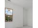 Bright bedroom with large window and neutral walls at 8200 Main S St # 1306, Woodstock, GA 30188