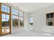 Living room with wall-to-wall windows and access to a balcony at 8200 Main S St # 1306, Woodstock, GA 30188